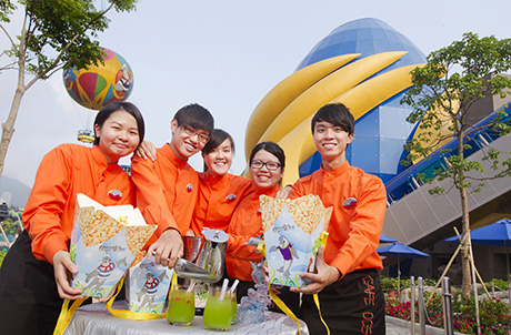 Photo 3 & 4: Graduating trainees demonstrate the preparation of a special drink in front of the Park’s new Grand Aquarium 
